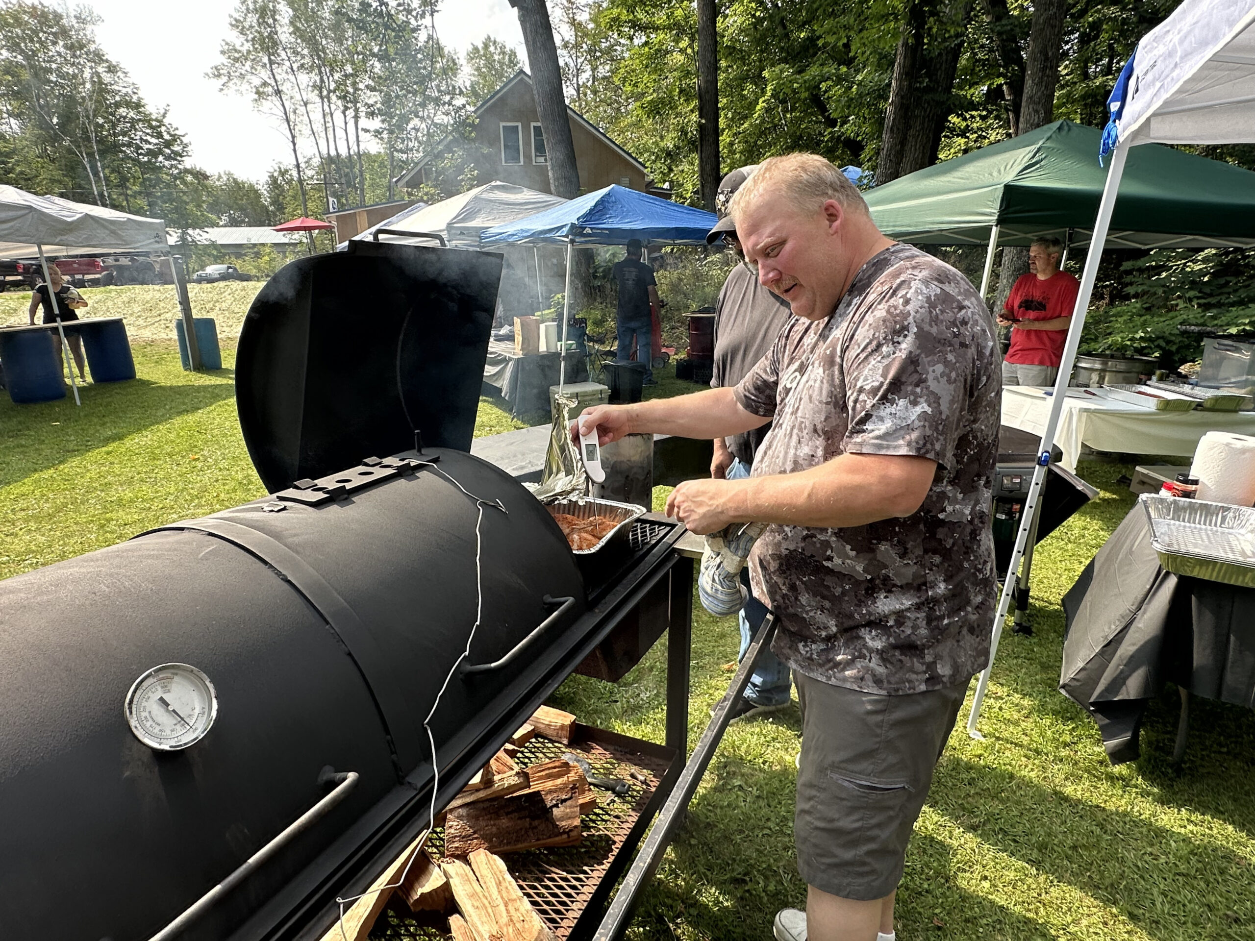 A man with a smoker at Hoot's rib cook off where PLA hosts a Meat Raffle to benefit the Association